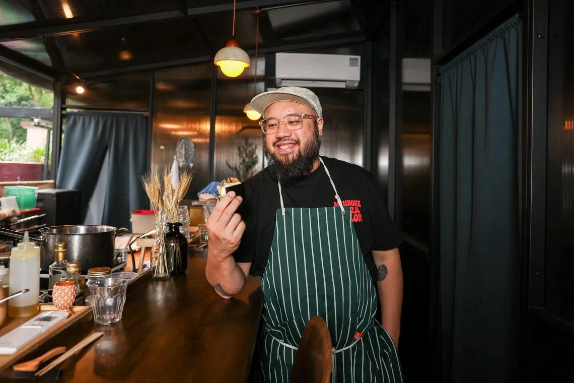 Chef Bjorn Shen serves bread "sushi" at his new restaurant, Jellyfish Sushi. 