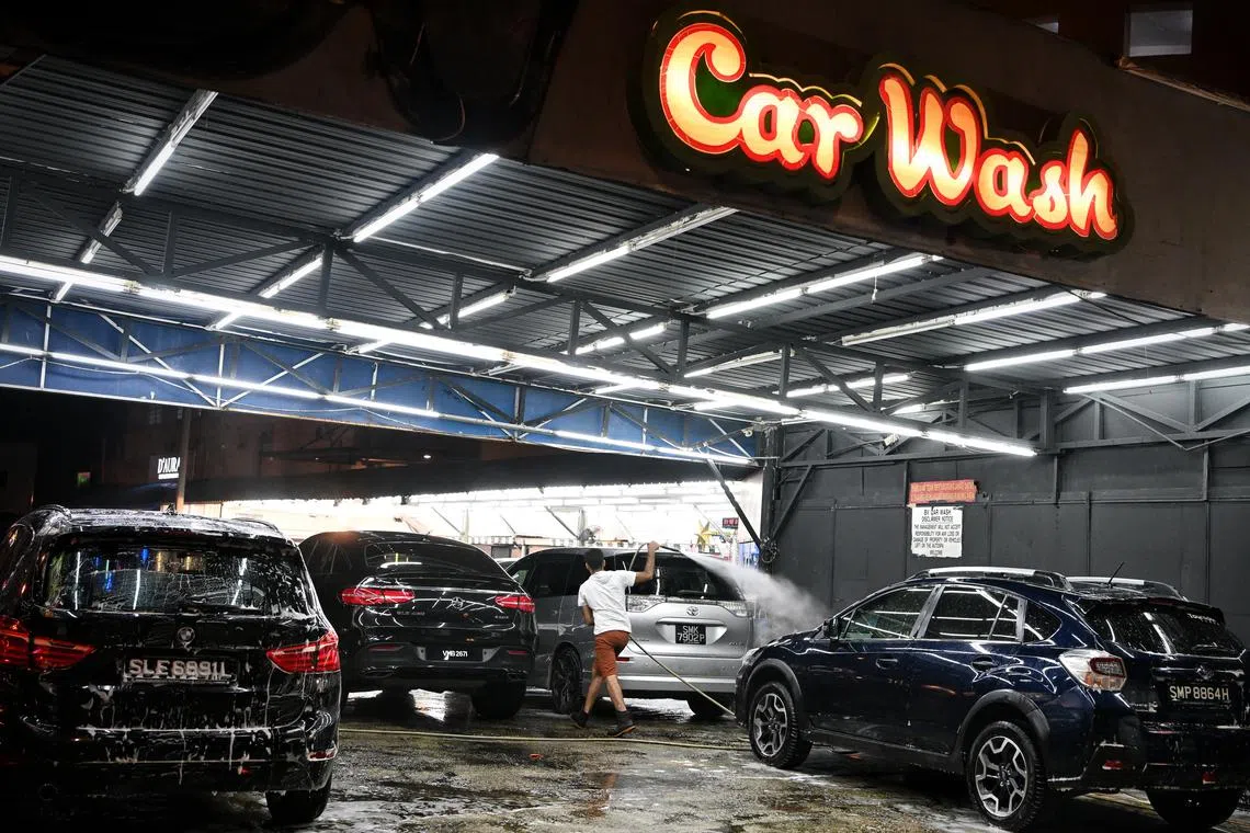 Singapore-registered cars at a car wash service in Johor Bahru on Sep 24, 2022.