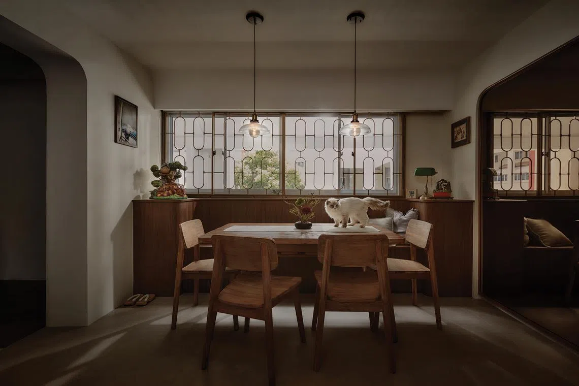 Retro window grilles, an original feature of the unit, lend this family's HDB maisonette an old-school charm.        