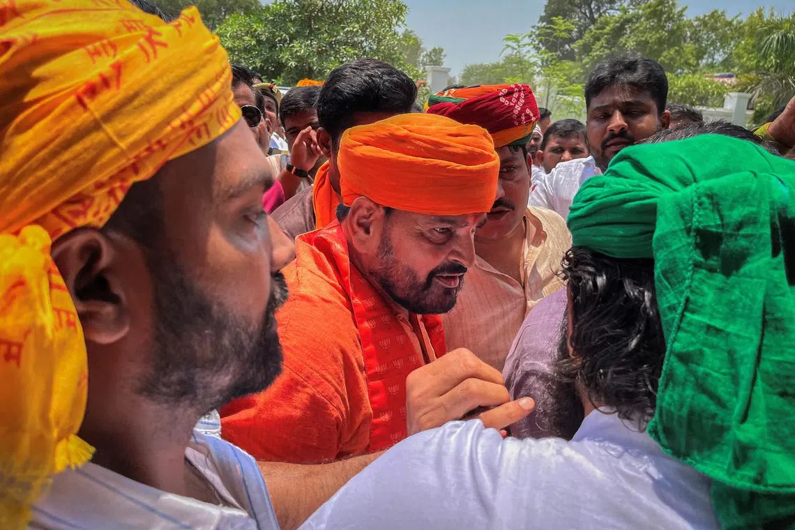 Brij Bhushan Sharan Singh (centre) has denied all the allegations.