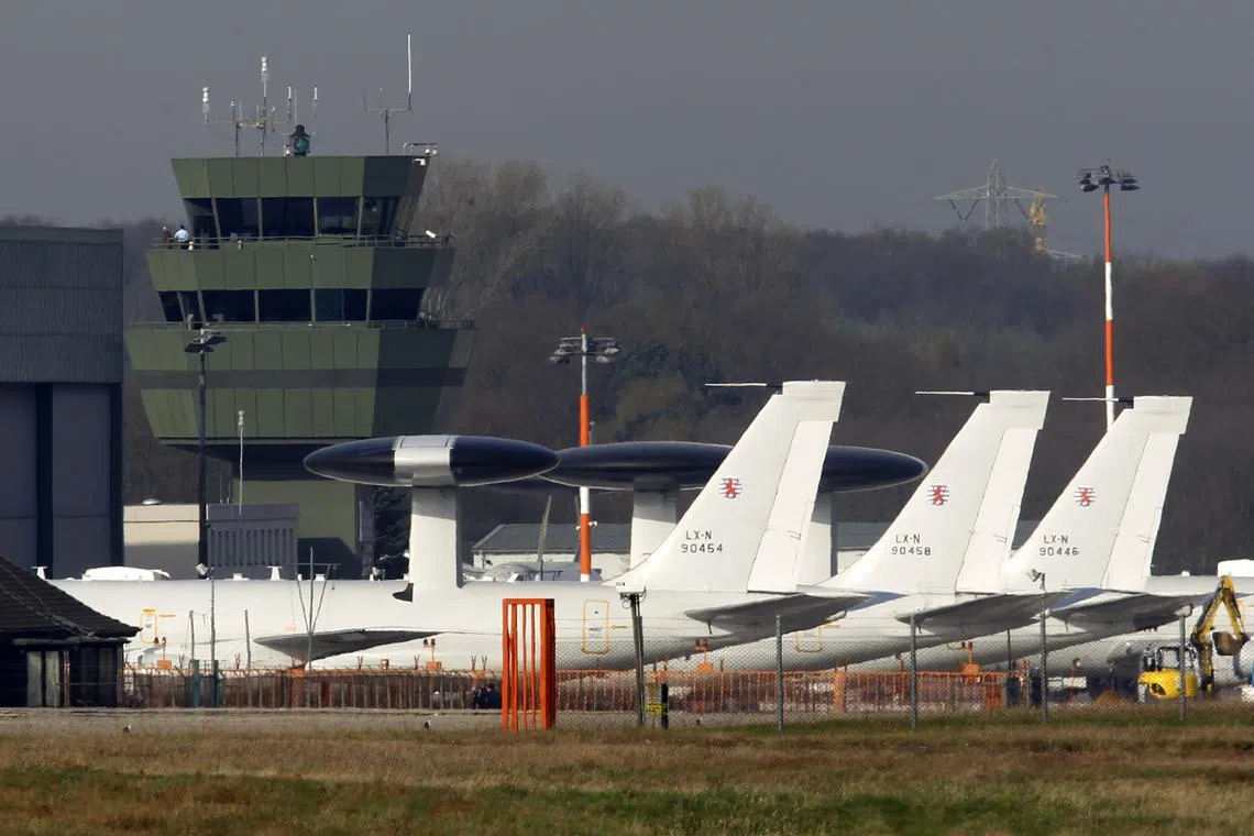 FILE PHOTO: NATO AWACS aircraft stand on the apron at the air base in Geilenkirchen near the German-Dutch border, April 3, 2014. REUTERS/Ina Fassbender/File Photo