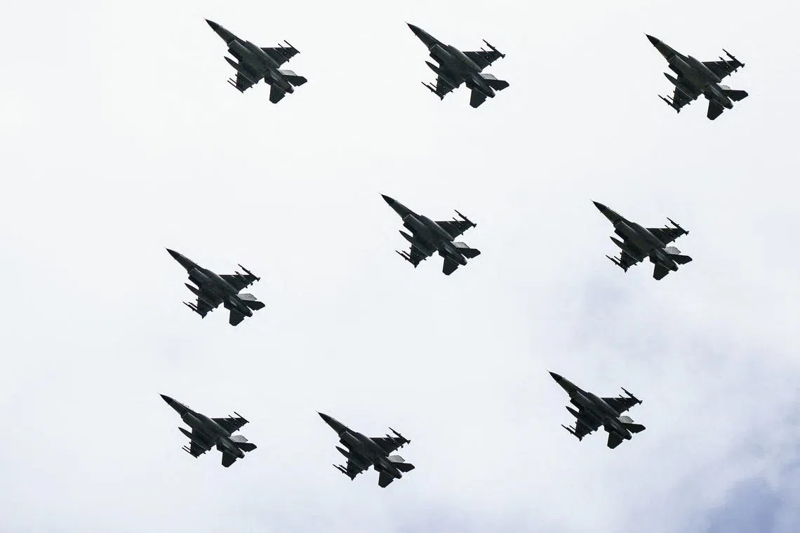 (FILES) F-16 aircrafts perform at the Danish Air Show at Karup Airport, on June 19, 2022. Denmark will retire its fleet of F-16 fighter earlier than planned, the Danish defence minister said on June 26, 2023, raising the likelihood that a number of them will be donated to Ukraine. The warplanes will be retired by 2025 instead of 2027 as the replacement F-35 aircraft from the United States "can be phased in and made operational earlier than planned," acting Defence Minister Troels Lund Poulsen told public broadcaster DR. "As a result, we are now in a situation where the F-16s can be retired earlier," he told the broadcaster. According to DR, a document submitted to parliament had shown that the F-16s were scheduled to remain in service until 2027. Denmark is currently finalising preparations for the training of Ukrainian pilots to fly F-16s on Danish soil, which the country hopes to begin before the end of the summer. (Photo by Henning Bagger / Ritzau Scanpix / AFP) / Denmark OUT