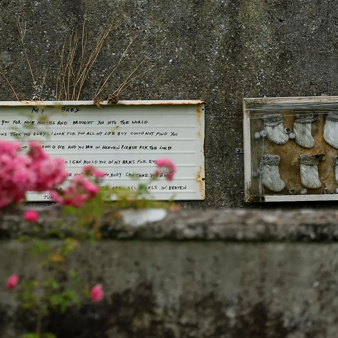 A memorial is put up at the Tuam graveyard, where the bodies of 796 babies were uncovered at the site of a former Catholic Church-run Bon Secours Mother and Baby Home, in Tuam, Ireland, July 7, 2025. REUTERS/Clodagh Kilcoyne