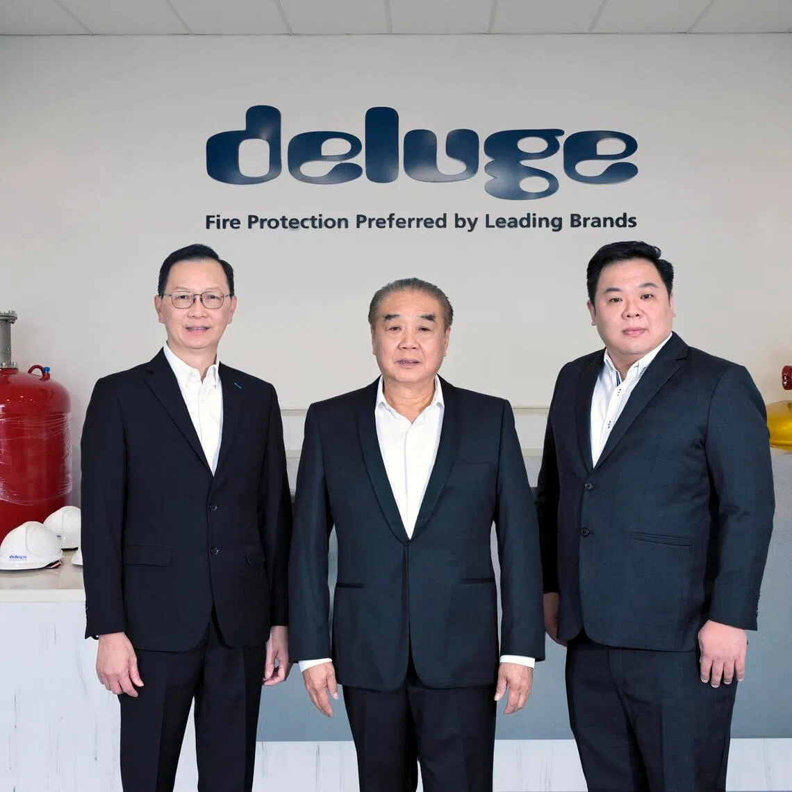 Deluge was previously in talks with Jardine Matheson to sell the business before opting for an SGX listing instead, said founder and chairman Vincent Cheo (centre), pictured with CEO Lee Wai Wah (left) and CFO Fredrik Tan.