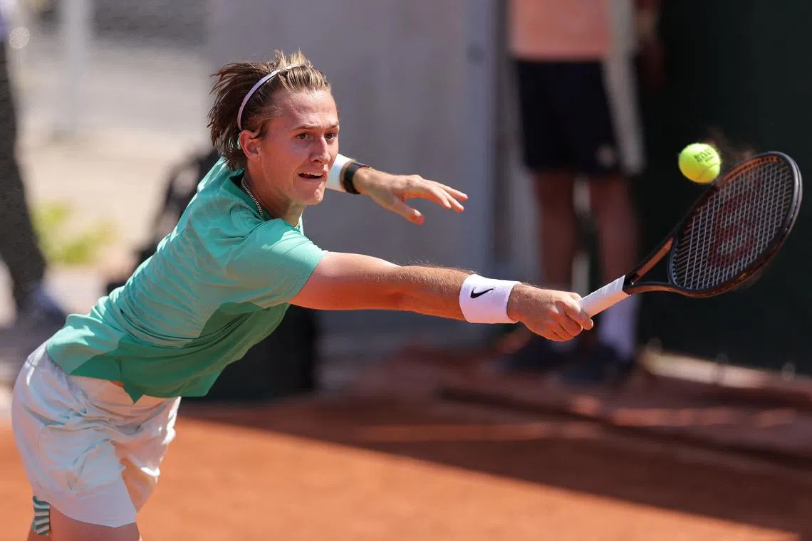US Sebastian Korda plays a backhand return to US Mackenzie Mcdonald during their men's singles match.