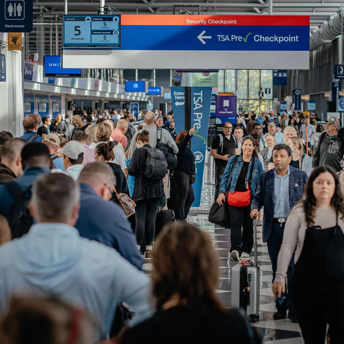 Passengers enter a security checkpoint at Chicago’s airport, as a US government shutdown reaches a record 40 days.
