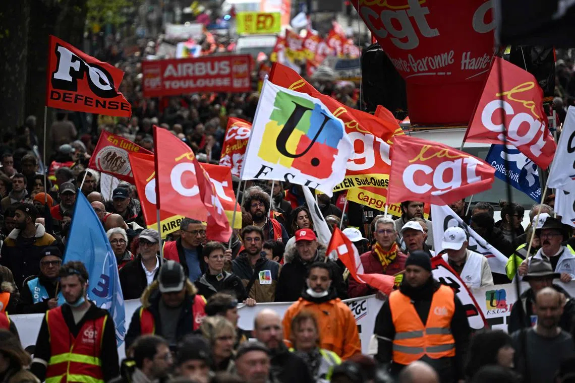 People take to the streets in Toulouse, south-western France, ahead of the Constitutional Council's ruling.