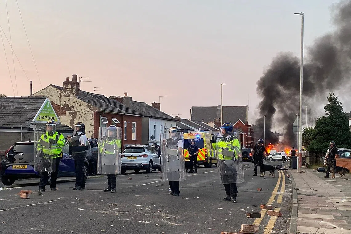 More than 50 police officers were injured in the ensuing violence, as demonstrators threw bricks at a mosque and set cars on fire.