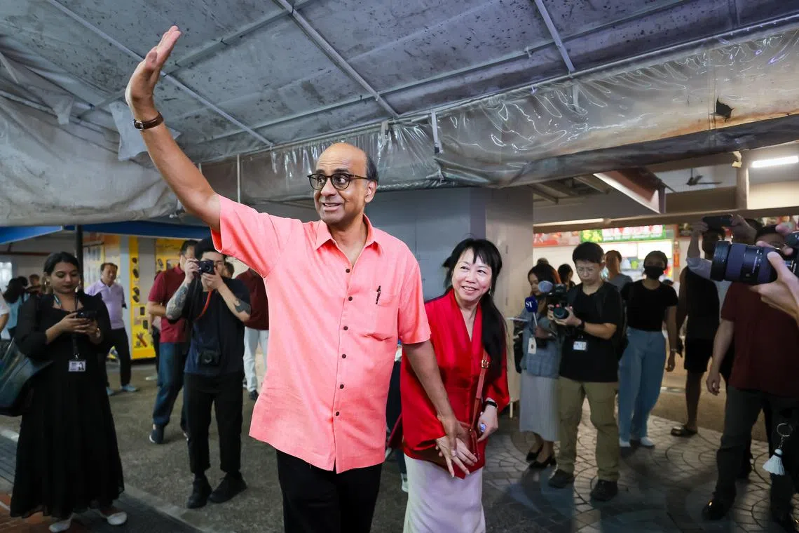 Presidential candidate Tharman Shanmugaratnam and his wife Jane Ittogi at a walkabout at Marine Parade Central Market and Food Centre on Aug 30.