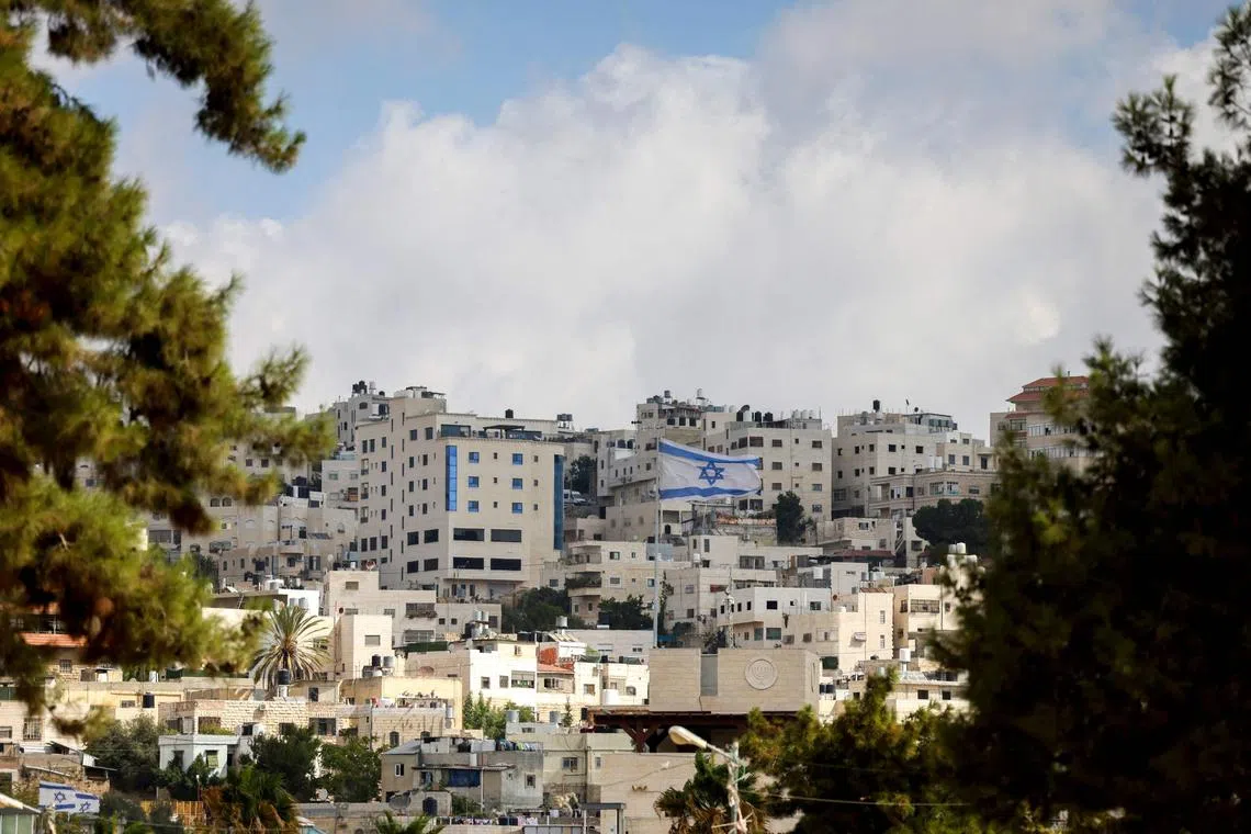 An Israeli national flag flying in an Israeli settlement in the occupied West Bank, on Sept 15.