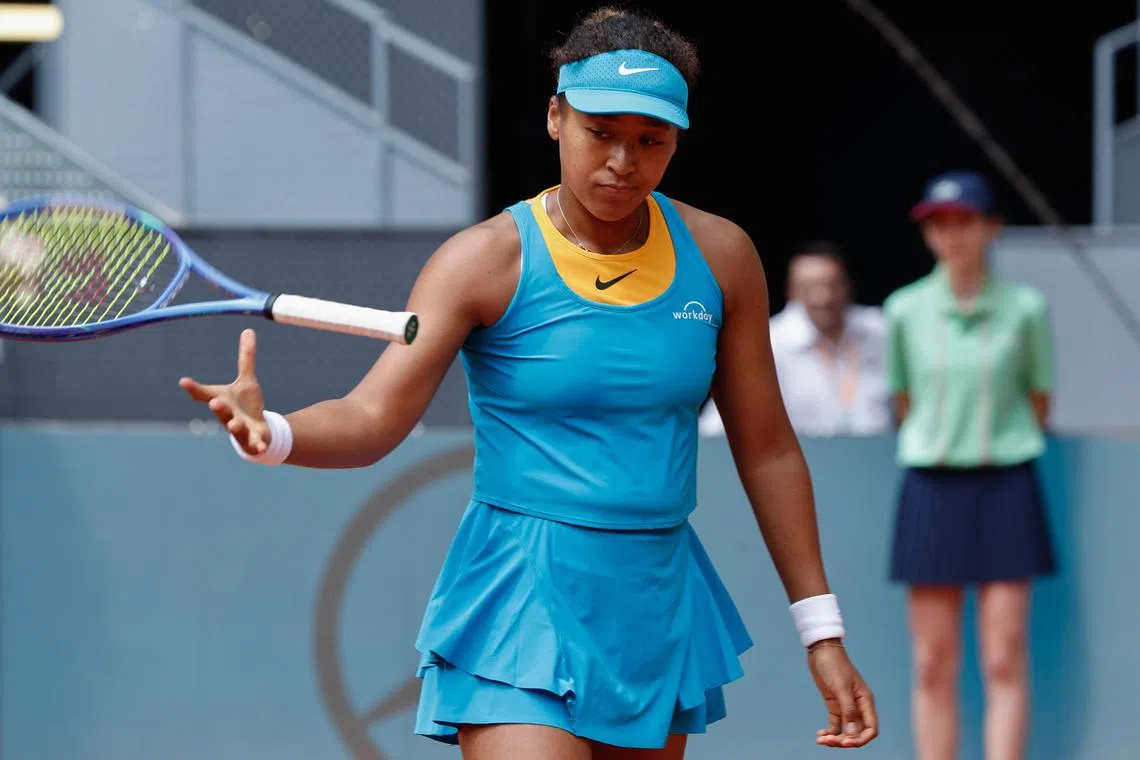 Japan's Naomi Osaka reacts after losing to Italy's Lucia Bronzetti in their first-round match on April 22.