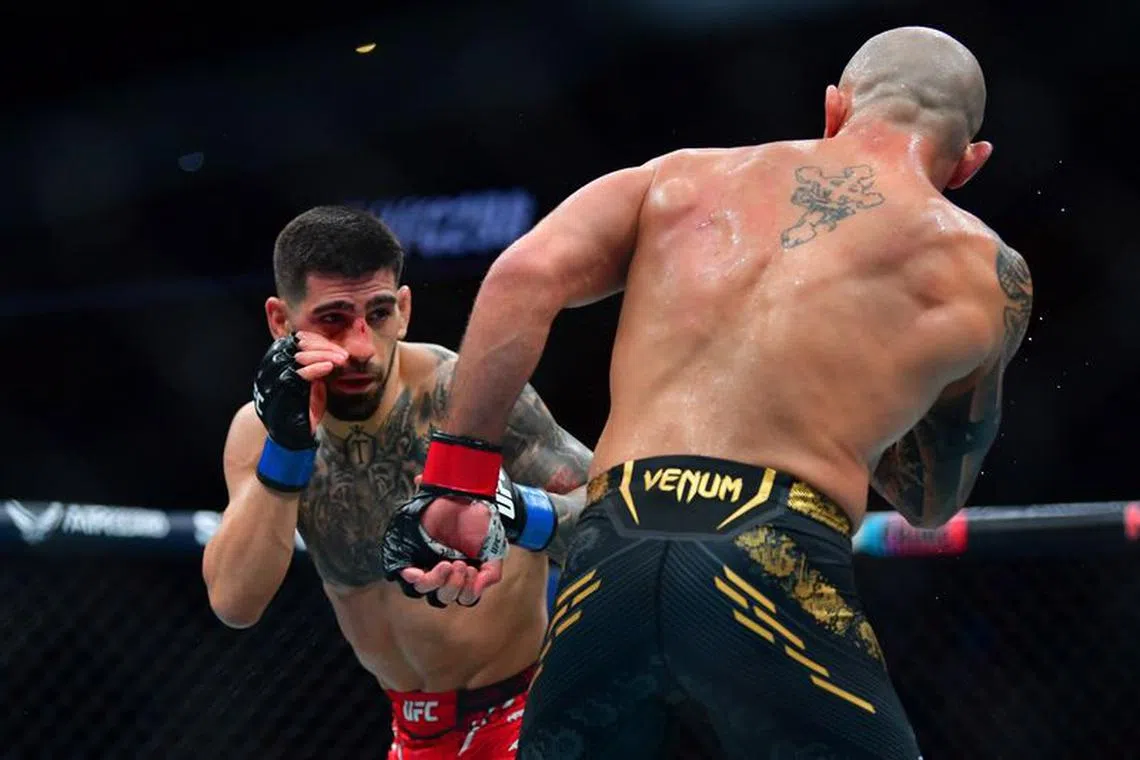 Feb 17, 2024; Anaheim, California, USA; Ilia Topuria fights against Alexander Volkanovski during UFC 298 at Honda Center. Mandatory Credit: Gary A. Vasquez-USA TODAY Sports