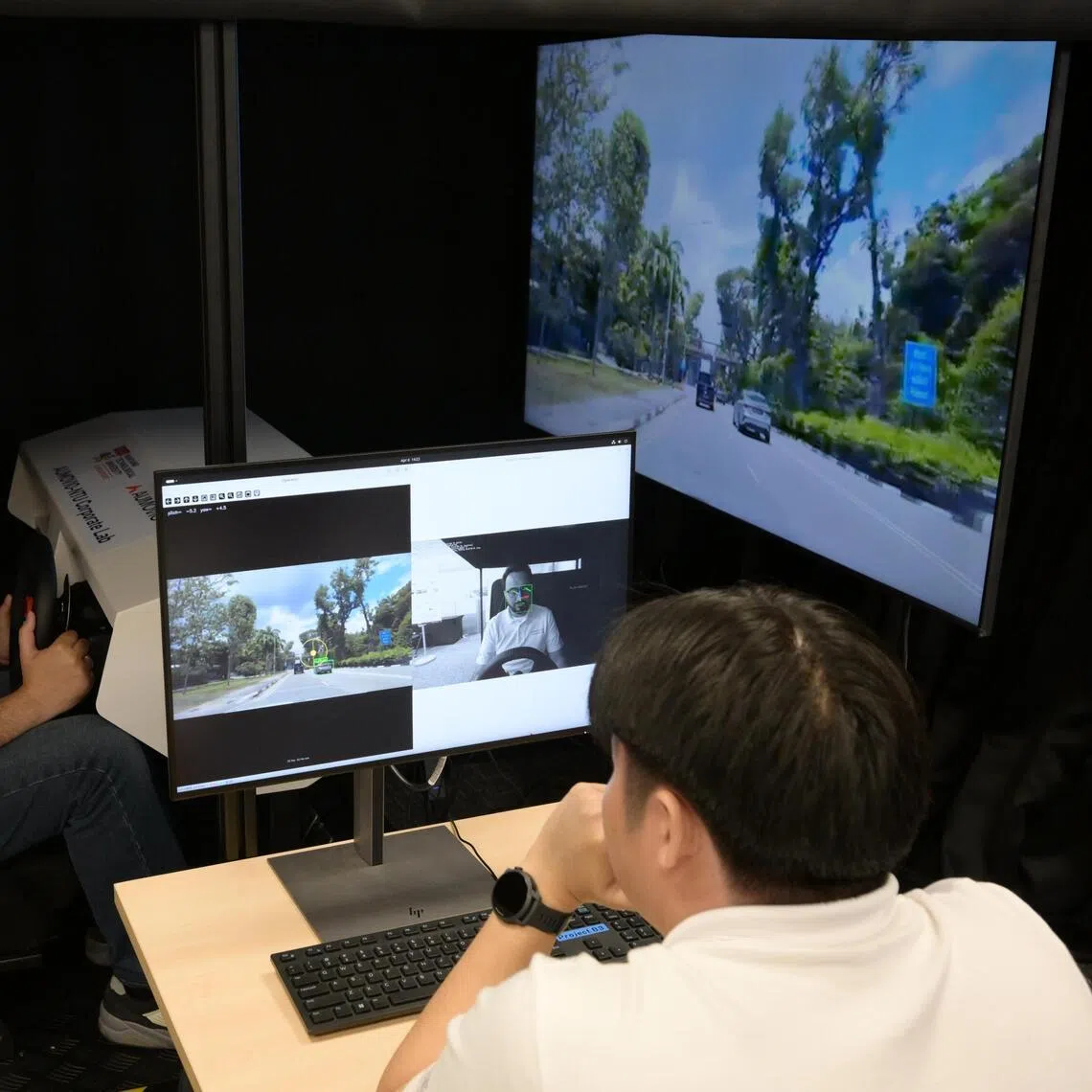 Researchers working on perception for human-machine joint situation awareness in autonomous driving at the AUMOVIO-NTU Corporate Lab on April 6, 2026.