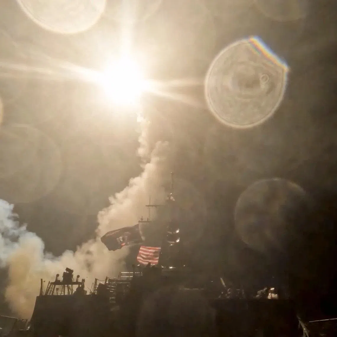 A U.S. warship launches a munition at an unknown location during what the U.S. military says is its latest wave of strikes on Iran, hitting \"Iranian military targets such as coastal surveillance and air defense sites, military logistics infrastructure, and maritime capabilities,\" in this still image taken from handout video released July 16, 2026.    U.S. Central Command/Handout via REUTERS