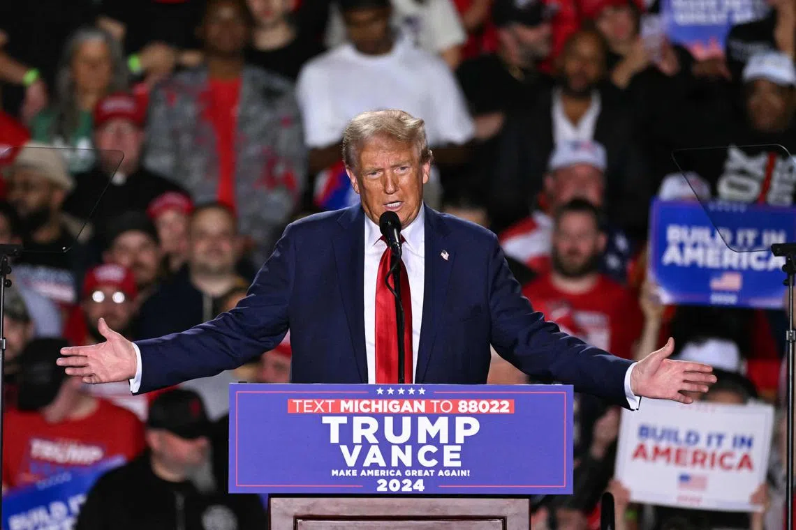 Former US President and Republican presidential candidate Donald Trump speaks during a campaign rally at Huntington Place in Detroit, Michigan, October 18, 2024. 