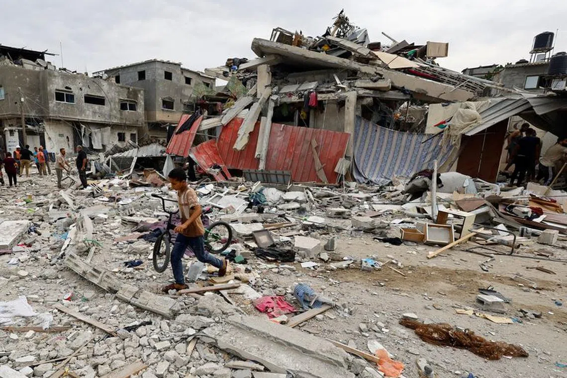 The site of an Israeli air strike on a house in Khan Younis in the southern Gaza Strip on Oct 27. 
