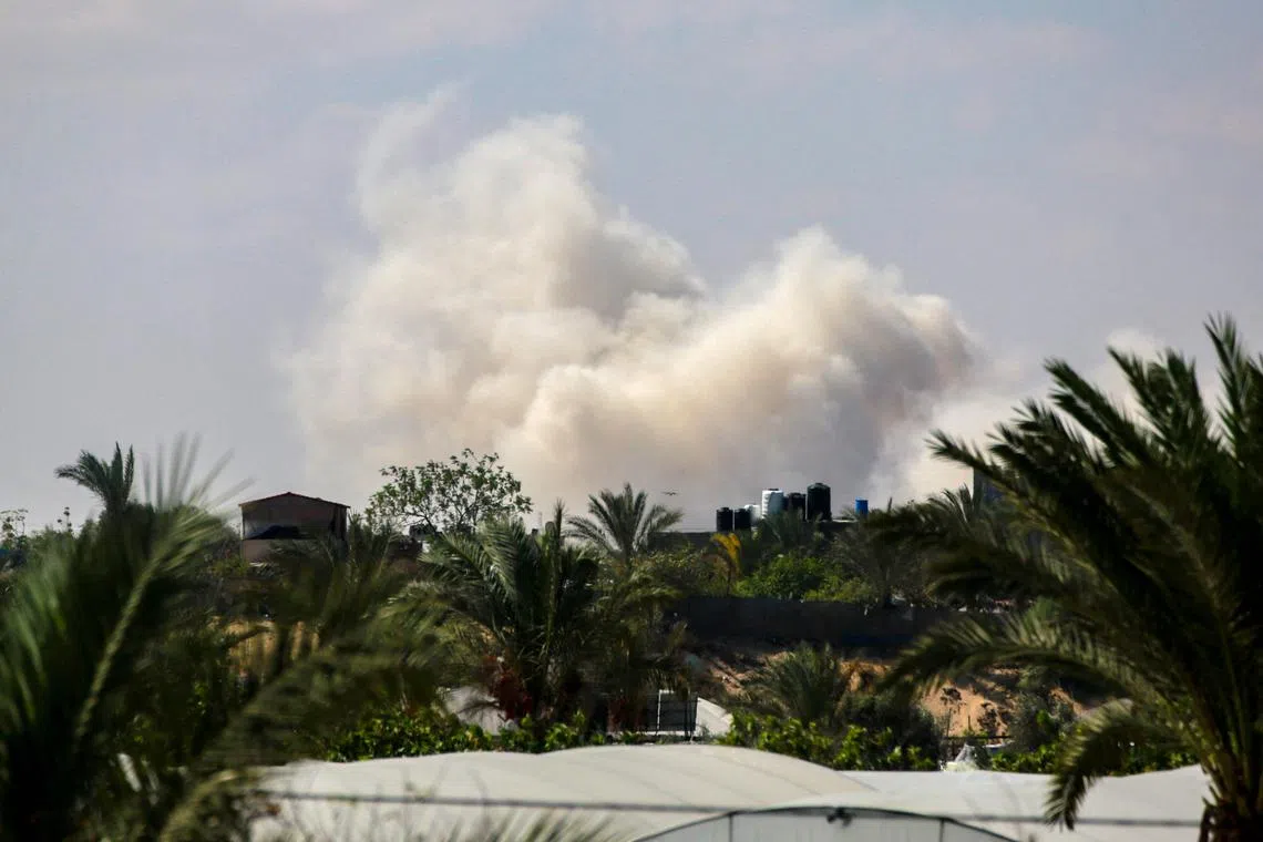 Smoke billows over an area targeted during Israeli bombardment in Rafah, in the southern Gaza Strip, on Sept 26.