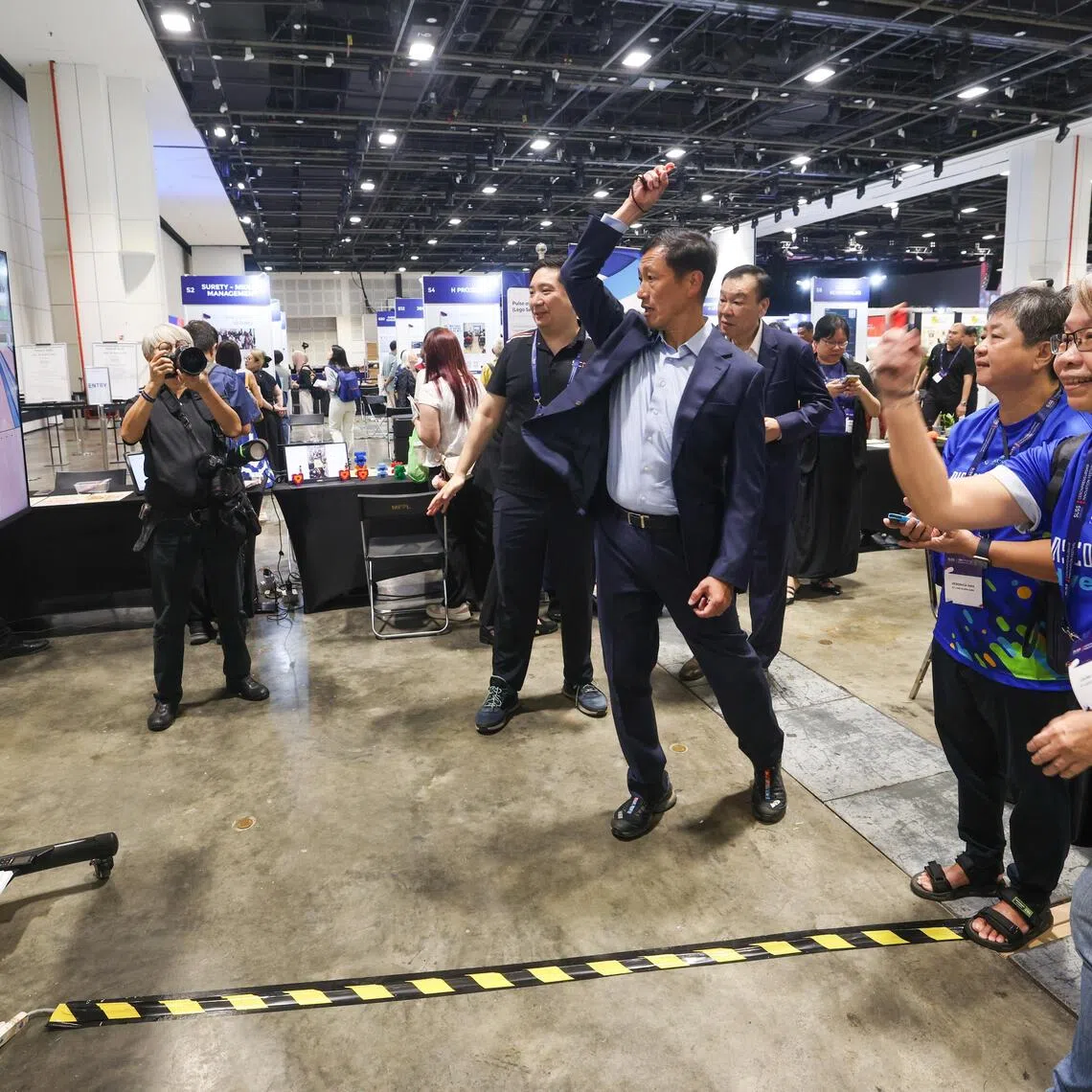 Minister for Health and Coordinating Minister for Social Policies Ong Ye Kung trying out virtual bowling at SUSS’ Geronpreneurship Innovation Festival, on Aug 26 at the Suntec Singapore Convention and Exhibition Centre.