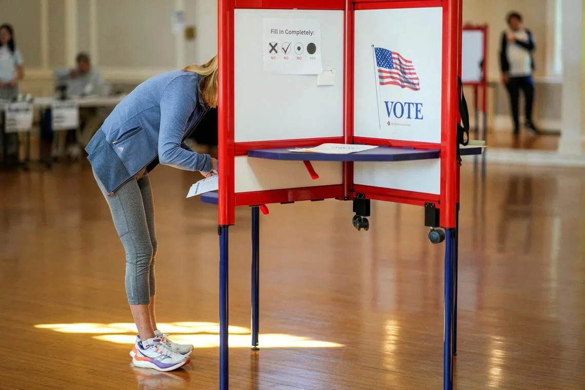 A person votes during the New Jersey primary elections for US Congress, in Glen Ridge, New Jersey, on June 2.