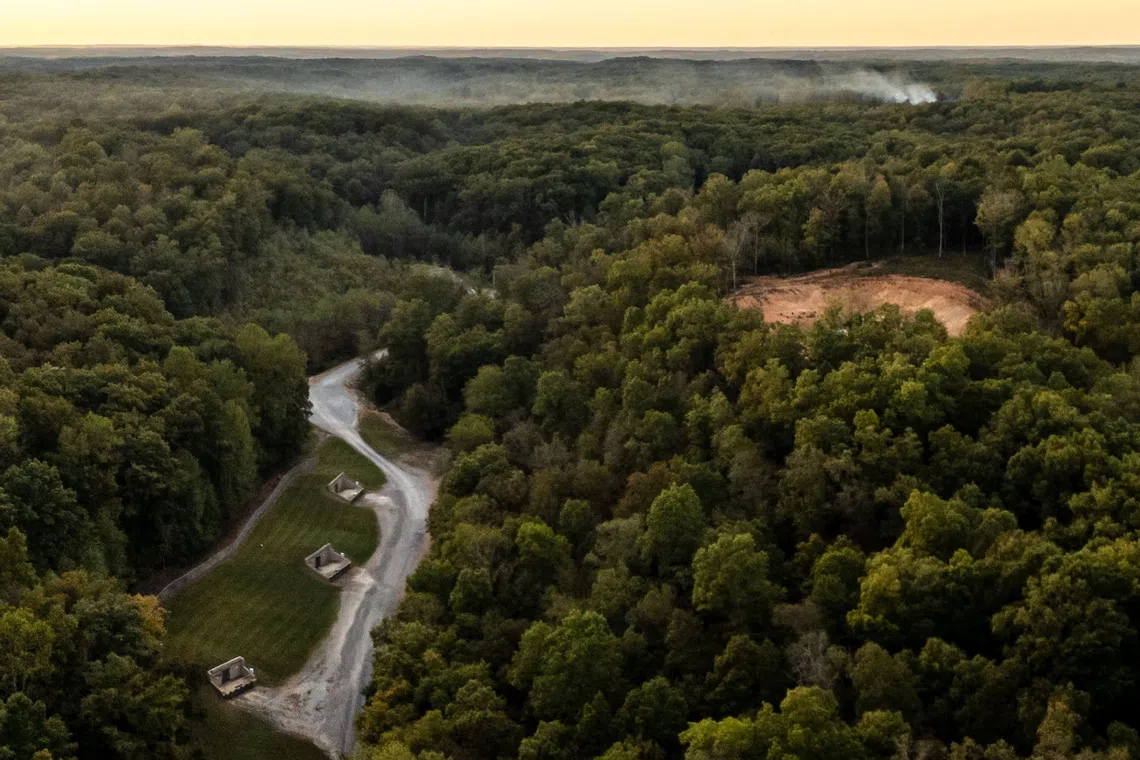 Smoke billows in the distance after an explosion at Accurate Energetic Systems in McEwen, Tennessee, on Oct 10.