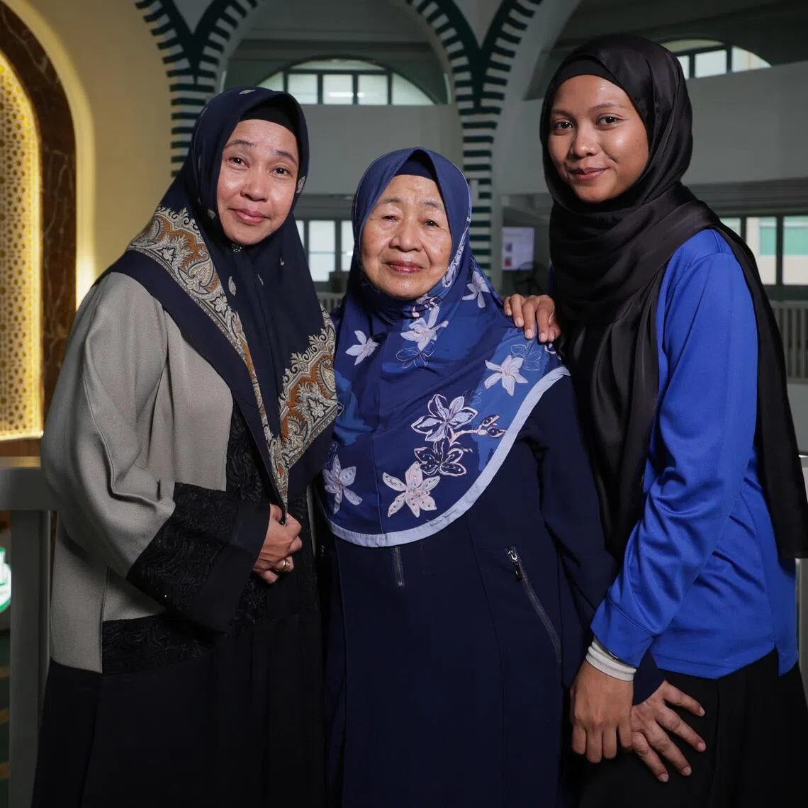 (From left): Hamidah Wan, 57; Ramlah Rasul, 71; and Allkin’s senior social worker Suriani Umar, 41, at Masjid Al-Muttaqin on Aug 26.