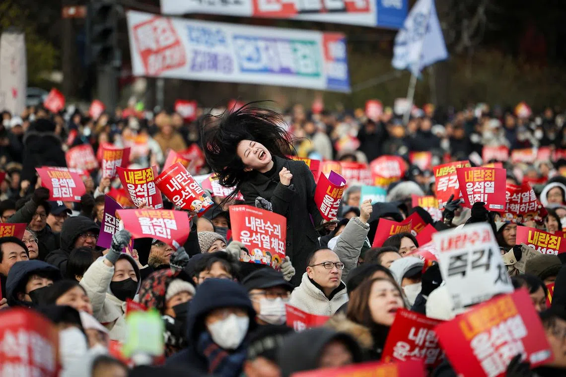 A protestor shouts slogans during a rally calling for the impeachment of South Korean President Yoon Suk Yeol, who declared martial law, which was reversed hours later, in front of the National Assembly in Seoul, South Korea, December 7, 2024. REUTERS/Kim Hong-ji