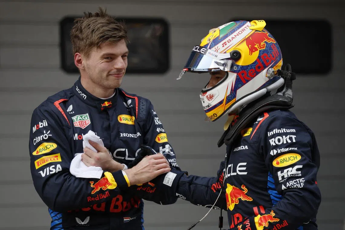 Red Bull's Max Verstappen celebrates with teammate Sergio Perez after taking pole position for the Chinese Grand Prix.