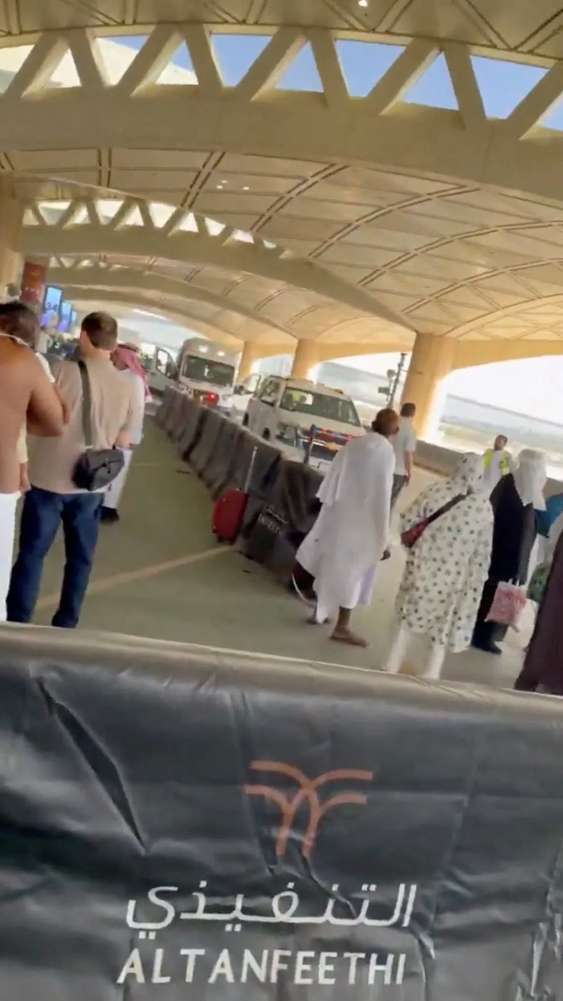 An ambulance is parked outside King Khalid International Airport on Oct 10 after several people were wounded in an attack on the airport that forced a suspension of operations.