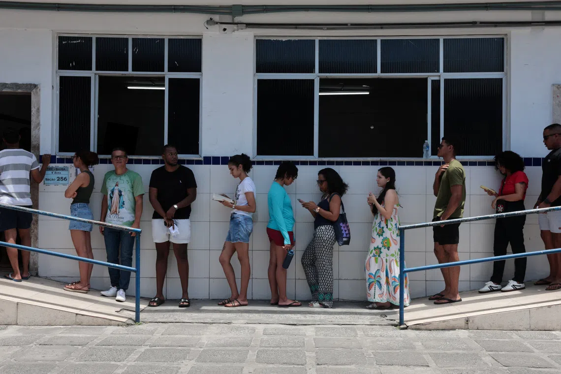 People wait in line to vote during Brazil's general election, in Salvador, Brazil, October 4, 2026. REUTERS/Antonello Veneri