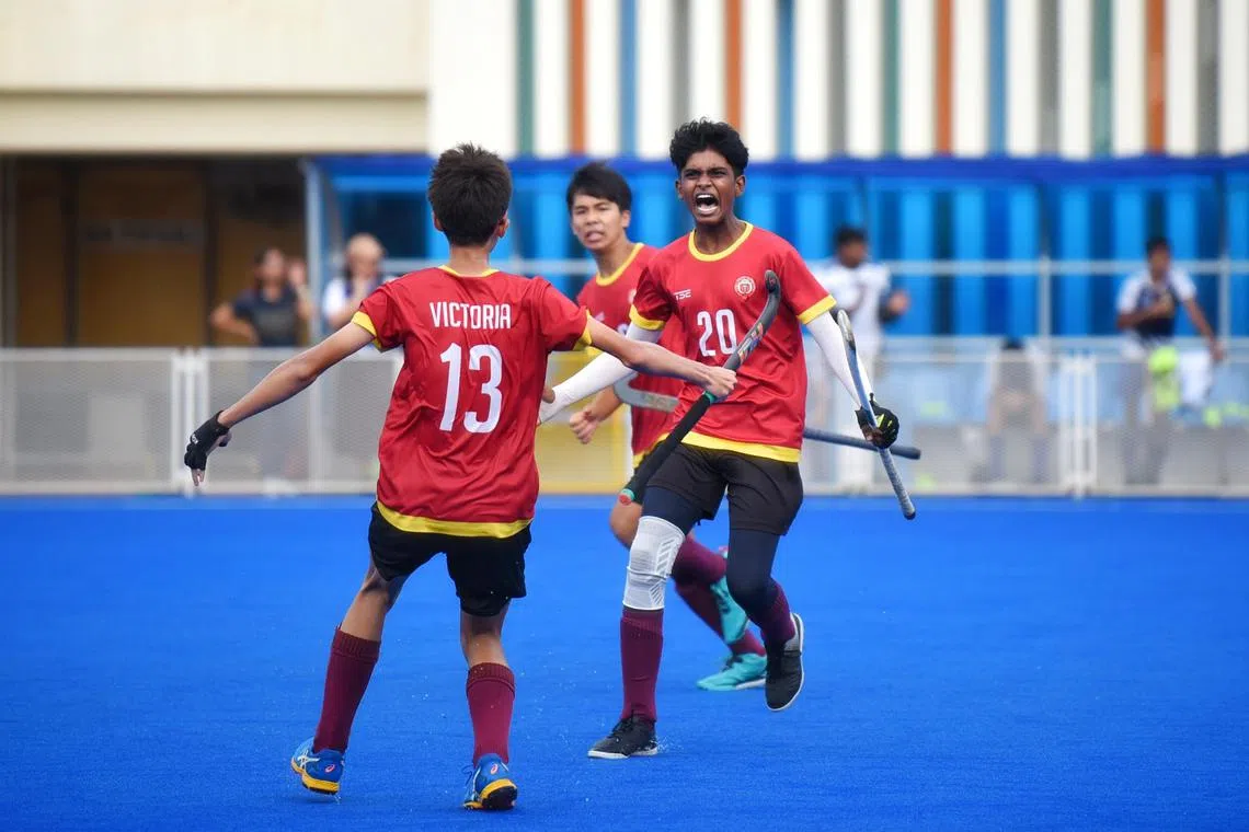 Victoria School's Rajkishan Rajakrishnan celebrating after scoring against St. Andrew's Secondary School in his first touch during the B-Division Boys Hockey Final at Sengkang Hockey Stadium on April 12, 2024. 