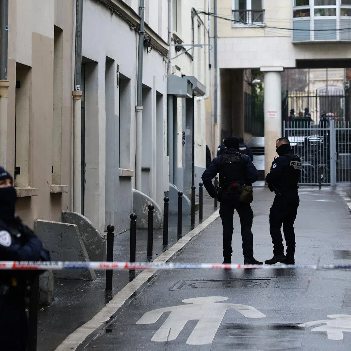 French police secure the area after a bomb threat at the headquarters of France's hard-left party France Unbowed on Feb 18. All employees were reported safe.
