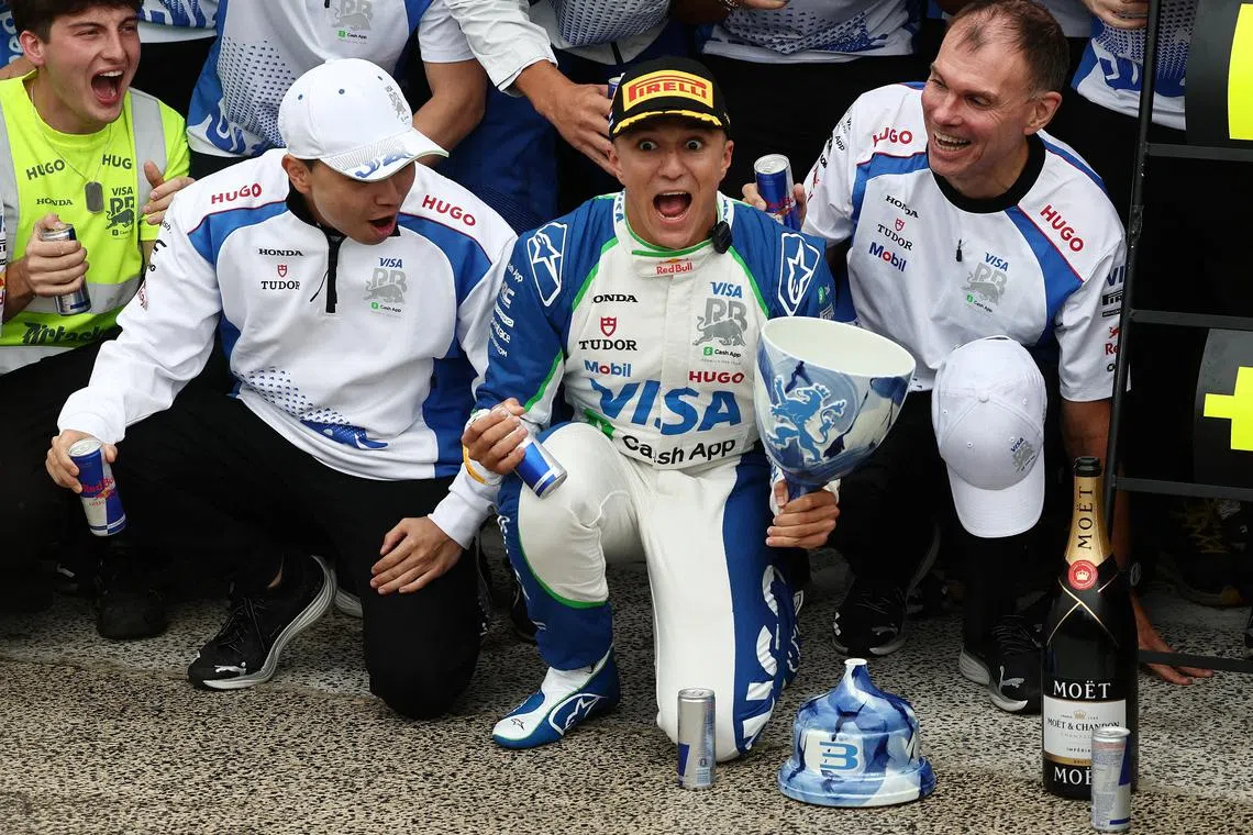Formula One F1 - Dutch Grand Prix - Circuit Zandvoort, Zandvoort, Netherlands - August 31, 2025 RB's Isack Hadjar celebrates with his team after finishing third place in the Dutch Grand Prix REUTERS/Jakub Porzycki