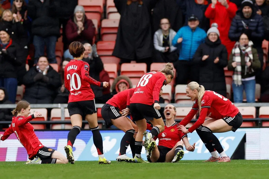 Soccer Football - Women's Super League - Manchester United v London City Lionesses - Leigh Sports Village, Leigh, Britain - February 15, 2026 Manchester United's Millie Turner celebrates scoring their second goal with teammates Action Images via Reuters/Jason Cairnduff