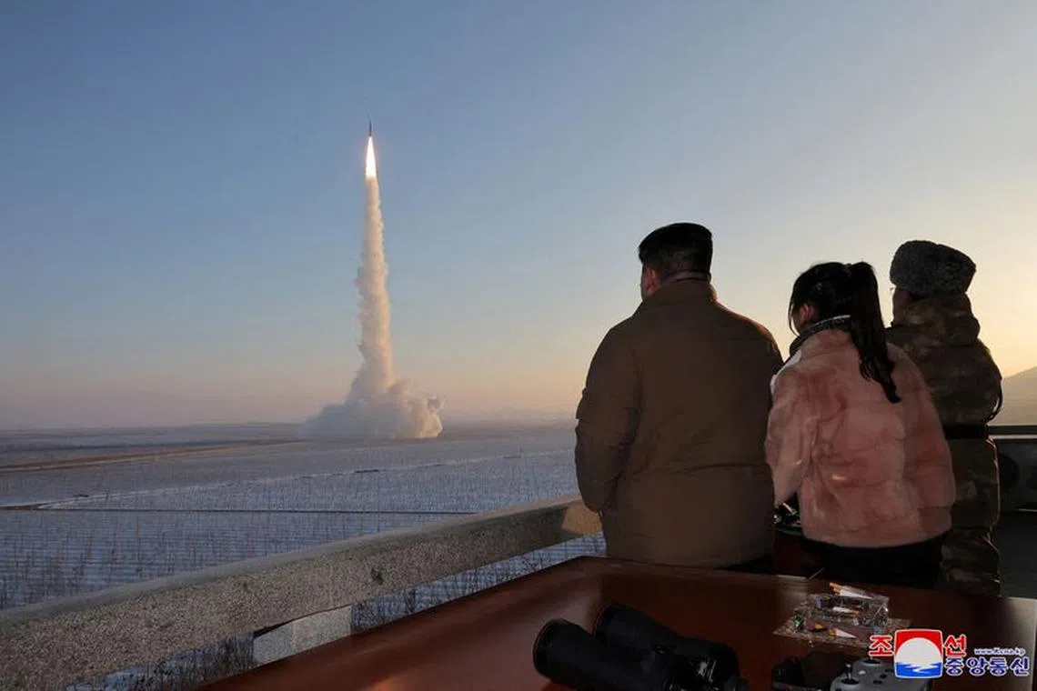 North Korean leader Kim Jong Un views the launch of a Hwasong-18 intercontinental ballistic missile during what North Korea says is a drill at an unknown location December 18, 2023 in this picture released by the Korean Central News Agency.     KCNA via REUTERS