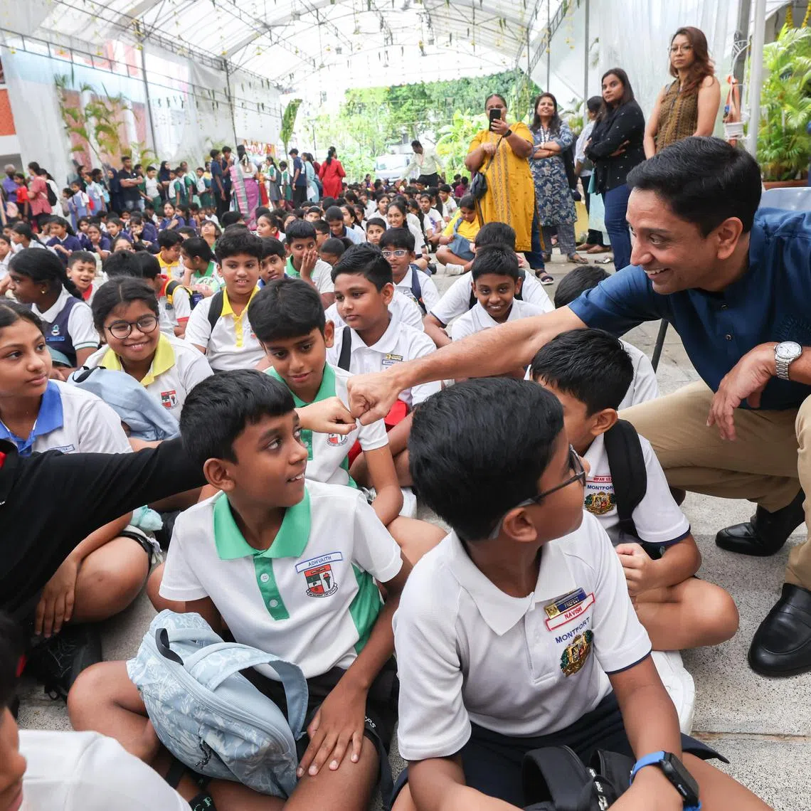 Minister of State for Culture, Community and Youth Dinesh Vasu Dash interacting with students at the Umar Pulavar Tamil Language Centre on Aug 23.