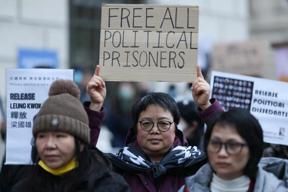 Protesters hold a rally in London to support 45 pro-democracy activists sentenced to jail by Hong Kong's High Court.