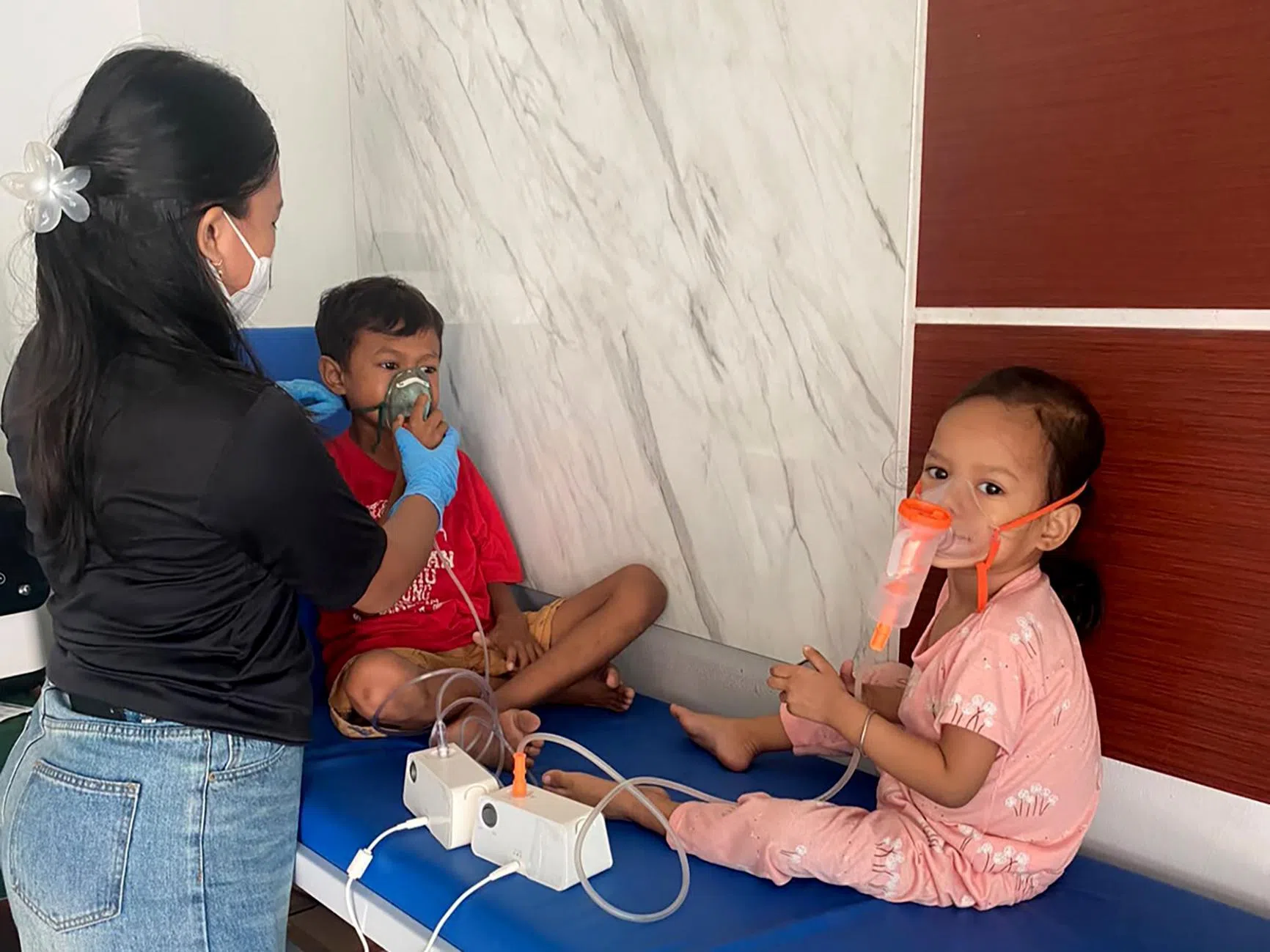 Residents in Palangkaraya, Central Kalimantan, at a haze shelter run by the Ranu Welum foundation.