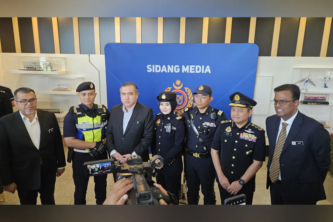 Malaysia Transport Minister Anthony Loke (third from left) said the operator of the bus involved in an accident on Oct 11  will face the music.