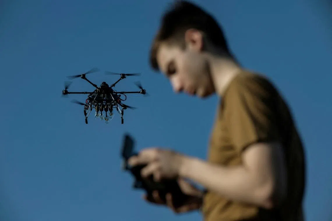 FILE PHOTO: Ukrainian serviceman of the 13th operational NGU Khartiia Brigade with the call signs 'Chipok' controls the Vampire drone during test and training flight, amid Russia's attack on Ukraine, at an undisclosed location in the Kharkiv region, Ukraine, April 22, 2025. REUTERS/Marko Djurica/File Photo
