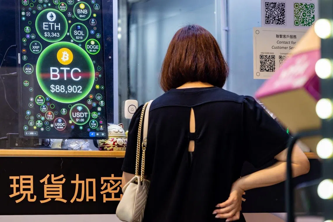 A screen shows the price of Bitcoin against US dollars at a cryptocurrency exchange store in Hong Kong on Nov 12, 2024. 