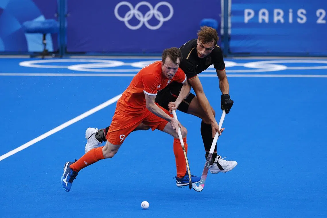 Seve van Ass of the Netherlands is marked by Moritz Ludwig of Germany in the Paris Olympics hockey final on Aug 8, 2024.