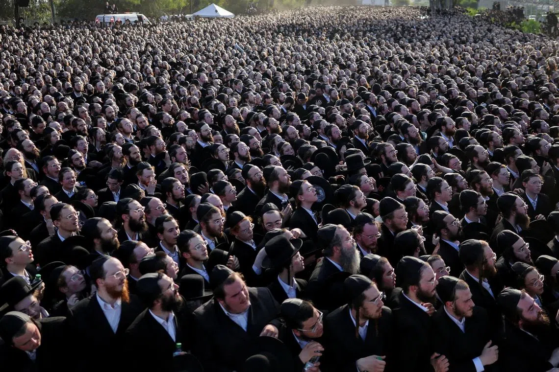Ultra-Orthodox Jewish men gathering during a protest  against military conscription near Kfar Yona, Israel, on June 17, 2026. 