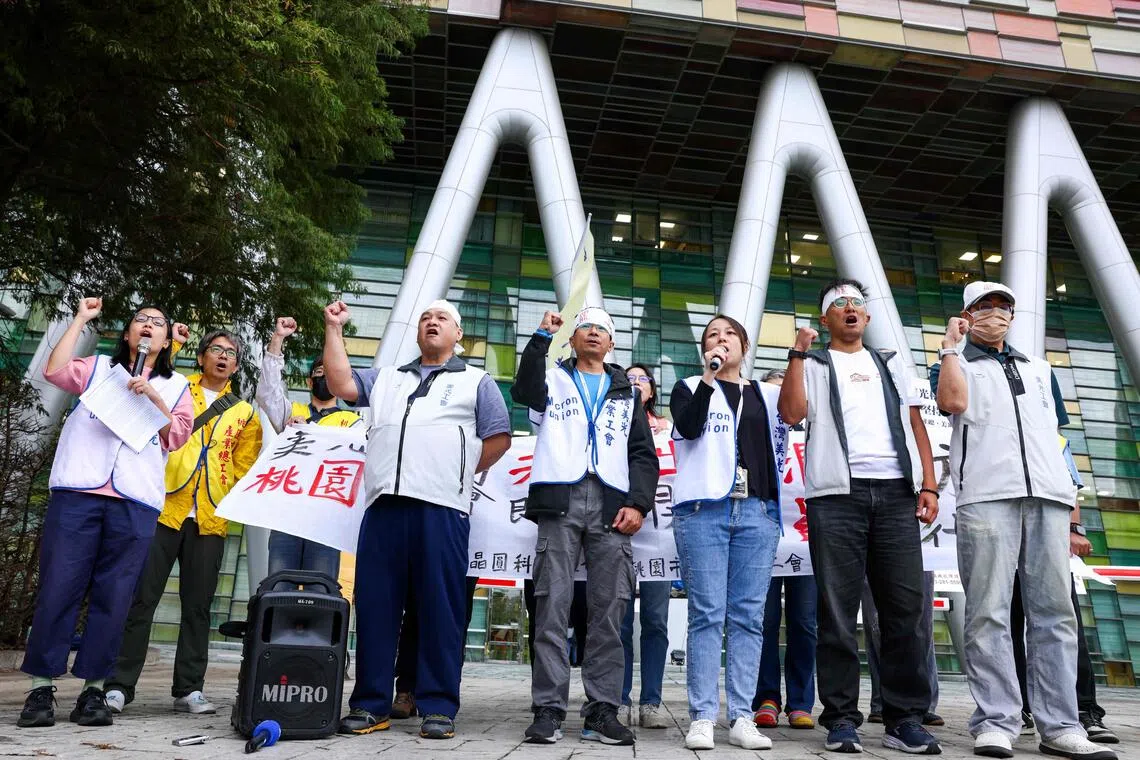 Taoyuan union representatives and Micron Technology union members gesture outside of the company’s building and announce a 24-hour strike demanding greater profit shares and better bonuses, in Taoyuan on Oct 22.