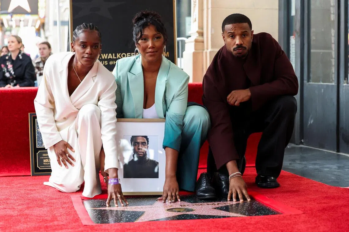 Chadwick Boseman's wife Simone Ledward-Boseman poses with Letitia Wright and Michael B. Jordan during the ceremony posthumously honoring Chadwick Boseman with a star on the Hollywood Walk of Fame in Los Angeles, California, U.S., November 20, 2025. REUTERS/Mario Anzuoni