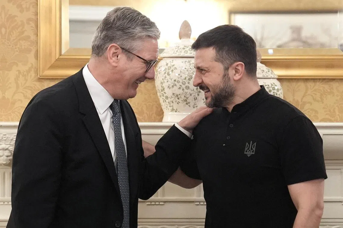 FILE PHOTO: Britain's Prime Minister Sir Keir Starmer meets President of Ukraine Volodymyr Zelenskiy, for a bilateral meeting at a hotel in Washington DC, US, ahead of the Nato summit.  July 10, 2024. Stefan Rousseau/Pool via REUTERS/File Photo