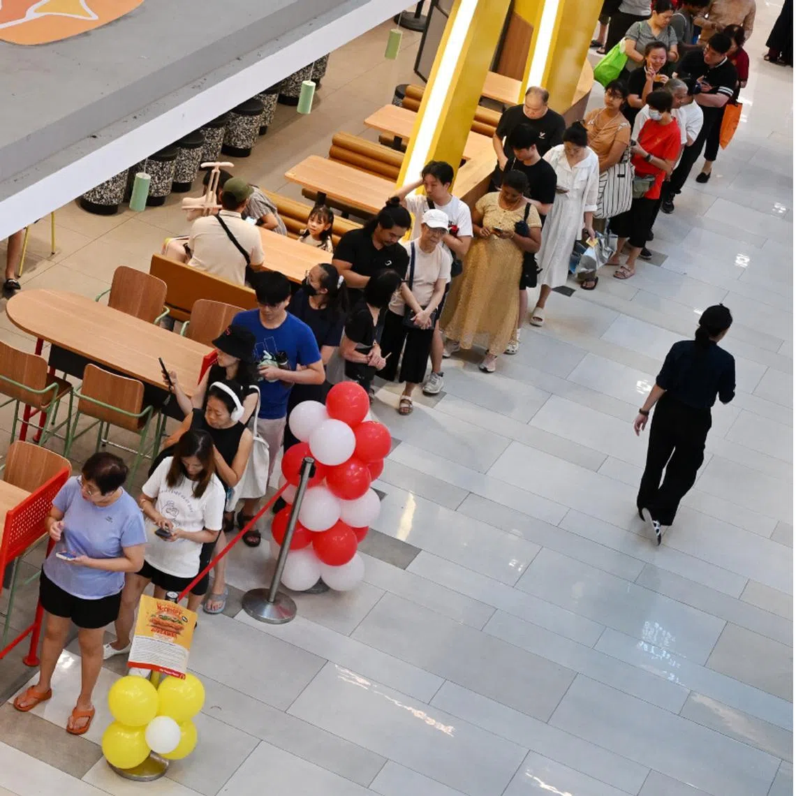 People queuing for the free and all-new McCrispy burger at the McDonald's outlet in City Square Mall, on Sept 4.