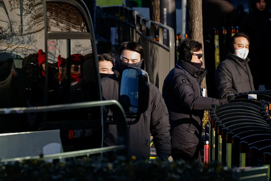 Security guards stand outside the official residence of impeached South Korean President Yoon Suk Yeol in Seoul, South Korea, on Jan 9.