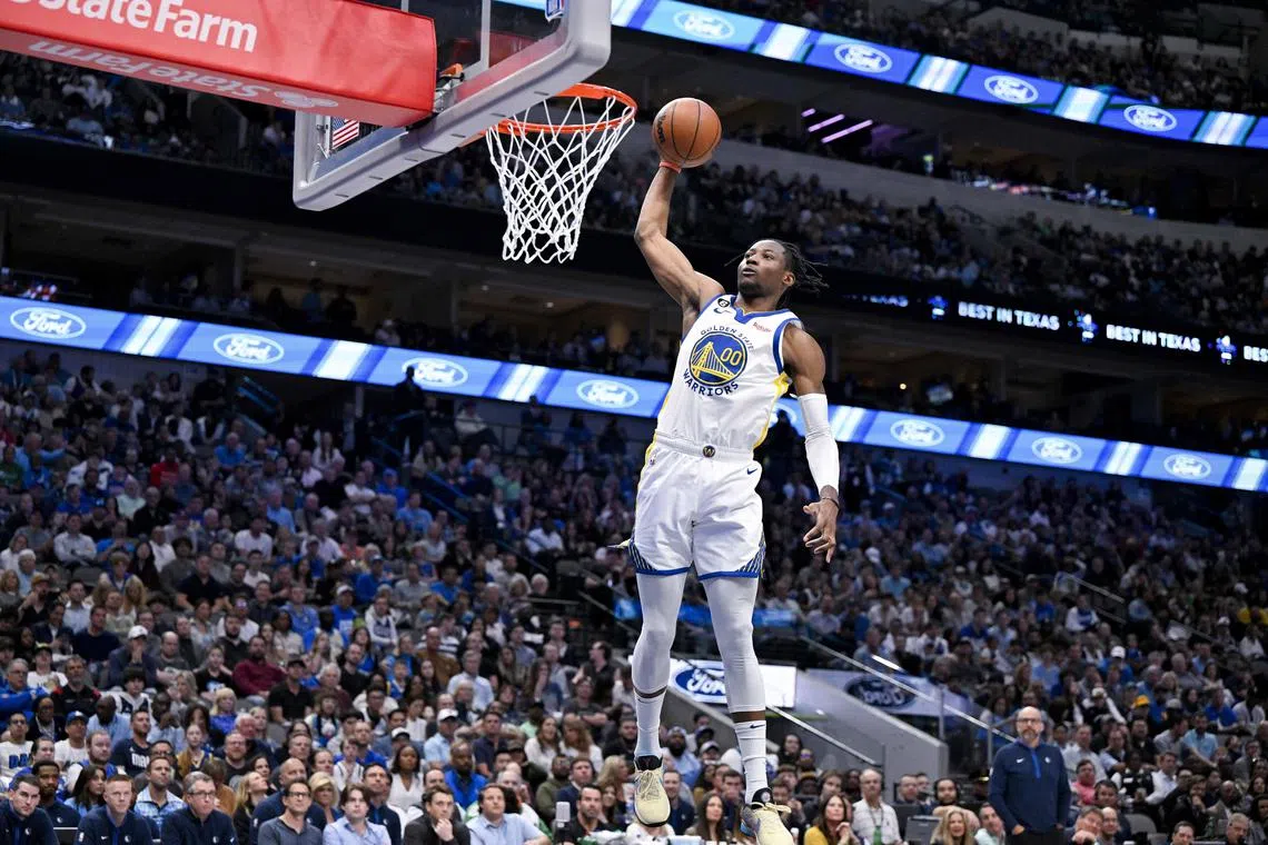 Golden State Warriors forward Jonathan Kuminga dunking the ball against the Dallas Mavericks during the second quarter at the American Airlines Centre.