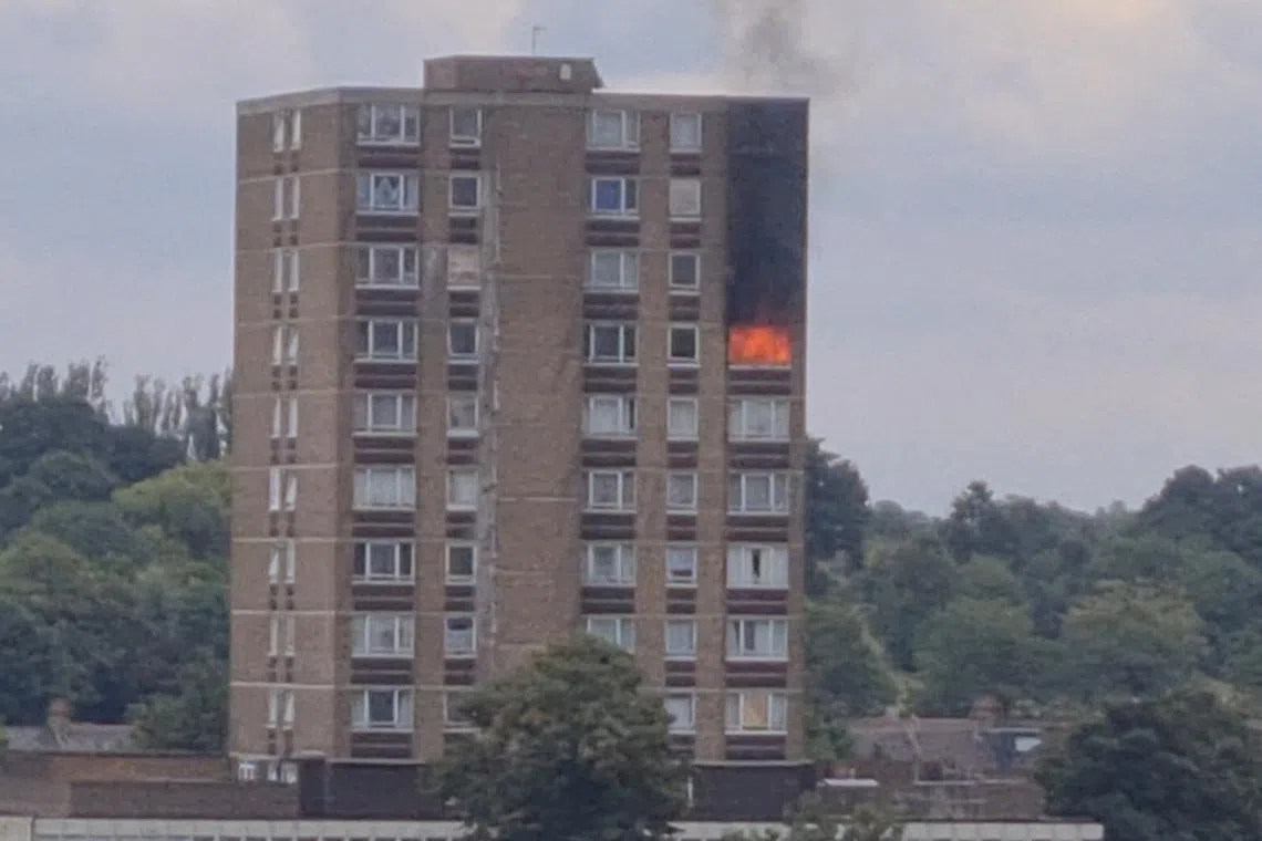 Flames and smoke rise from the window of a residential tower block in London, Britain, September 4, 2024, in this screengrab from a video obtained from social media. @m_elonhead/X/via REUTERS