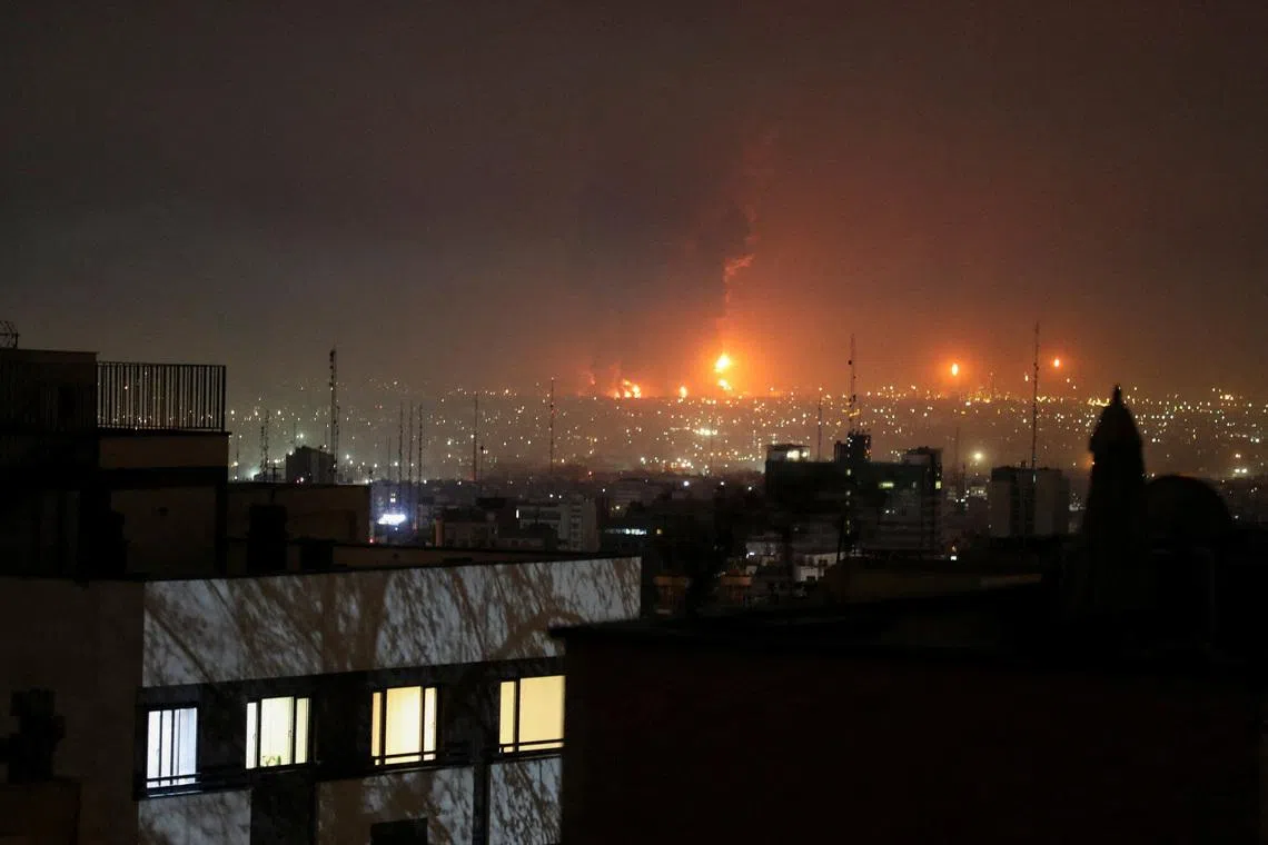 Smoke rises following an explosion in Tehran, March 7.
